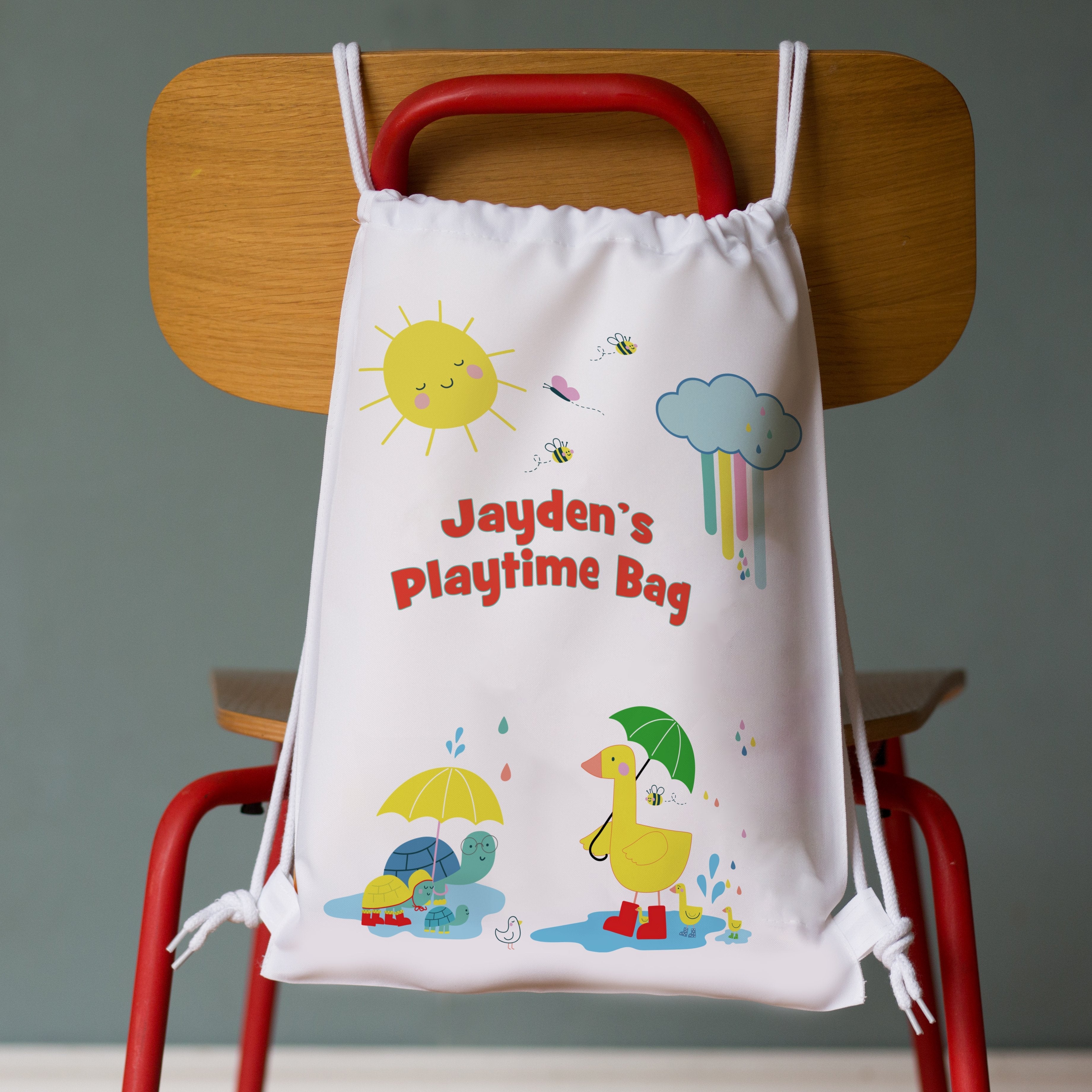 Children's drawstring bag with colourful rainy day duck and turtle illustrations