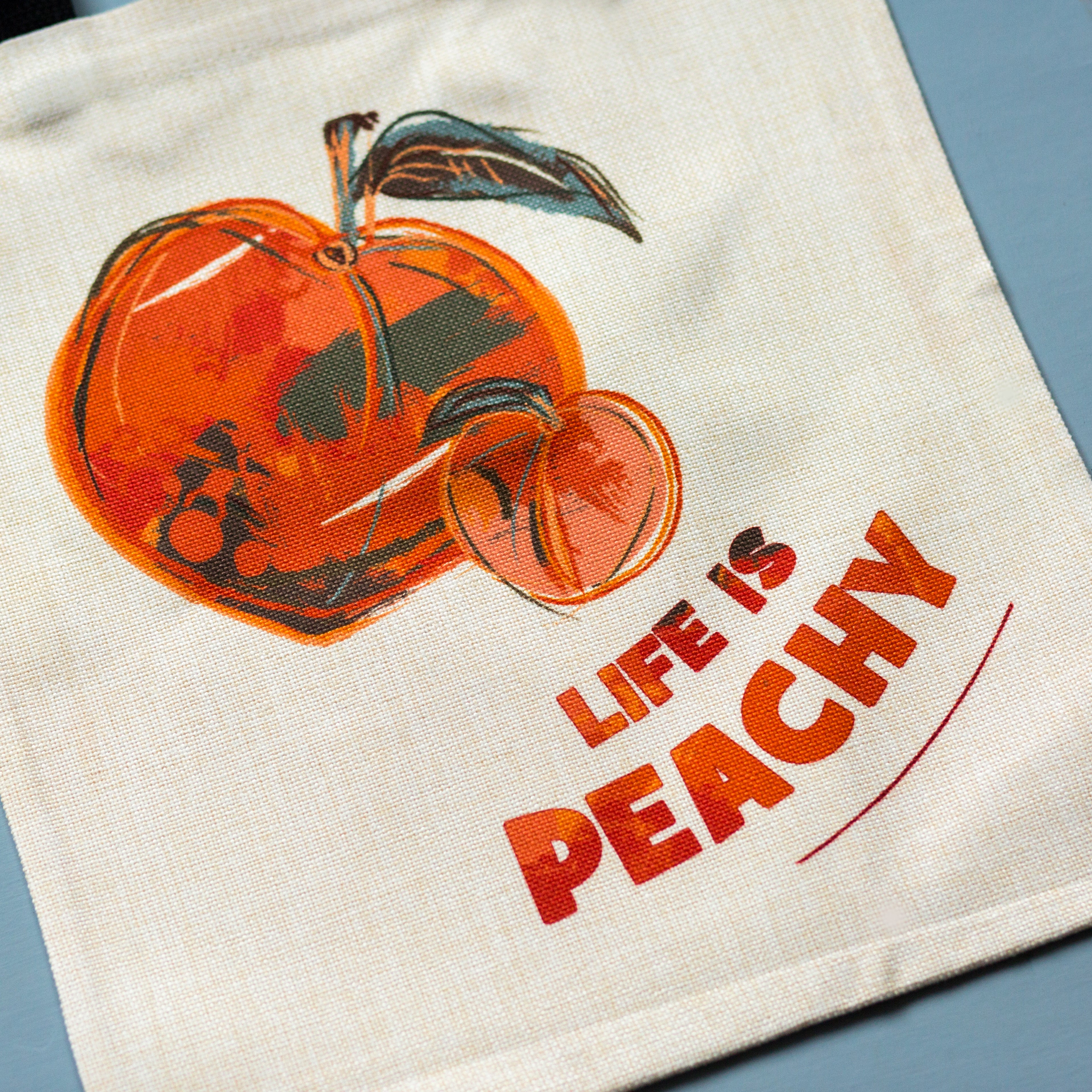 Close up of peach illustration tote bag