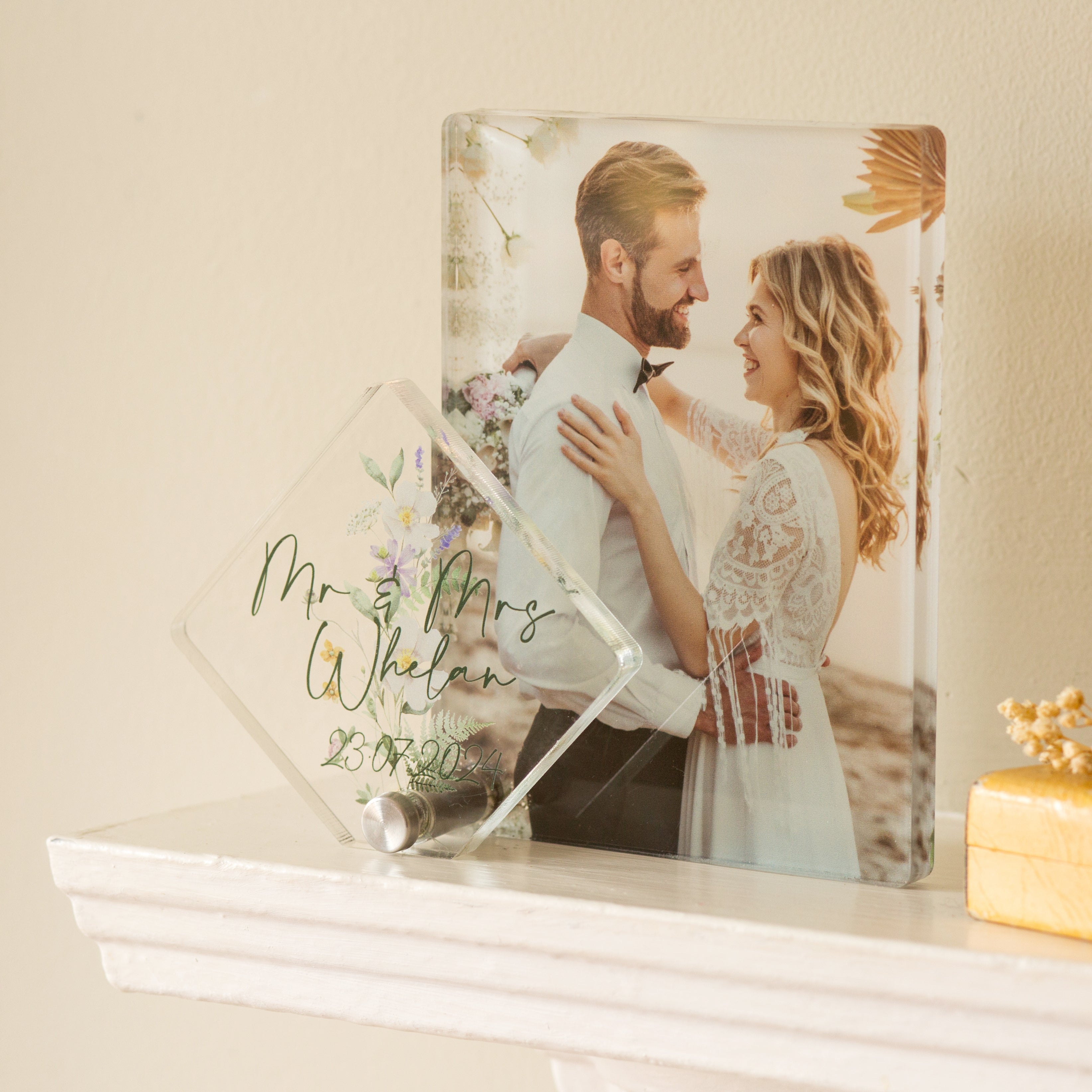 freestanding anniversary photo acrylic stand on a fireplace