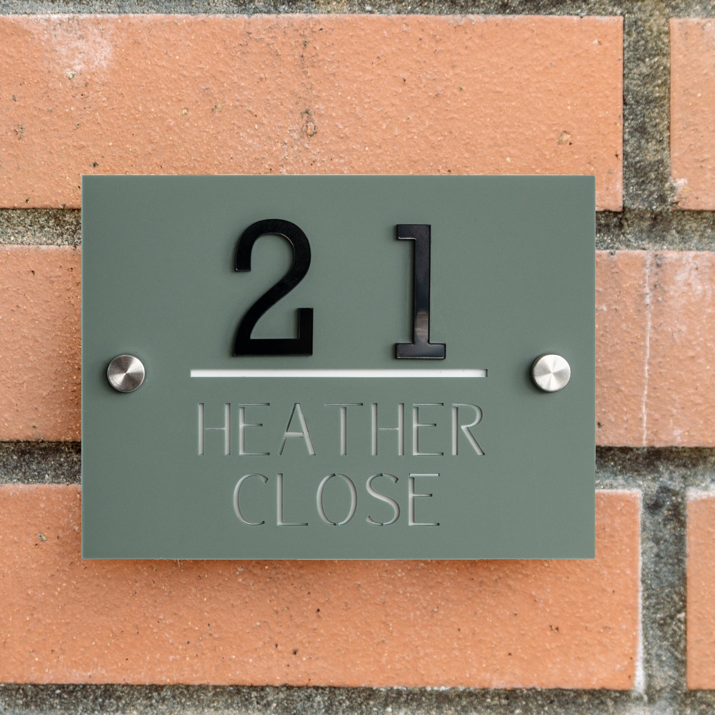 matt acrylic house sign in pine green with 3D black acrylic number
